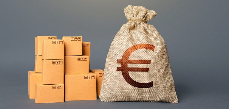 Boxes and Euro money bag. The concept of trade in goods and production. Business industry. Delivering. Profit from trading. Financial success. GDP and economy. Import export. Warehousing logistics.